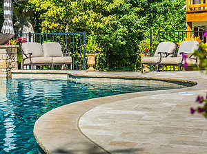 st louis pool construction, custom concrete pool, freeform, travertine patio