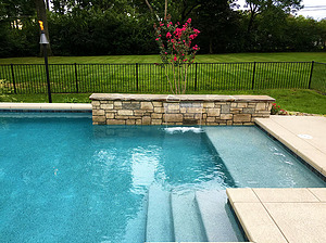 st louis pool construction, custom concrete pool, stair entry, tan shelf, raised wall, sheer descent