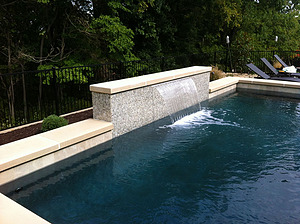 st louis pool construction, custom concrete pool, sheer descent, raised wall, pebble finish