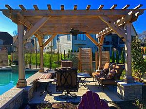 st. louis pool construction, metal outdoor furniture with tan and red cushions, wooden pergola