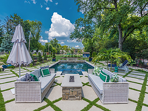 st. louis pool construction, white wicker outdoor furniture with colorful pillows, fire pit