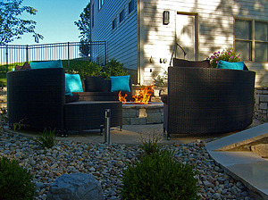 st. louis pool construction, black wicker outdoor furniture with blue pillows, fire pit