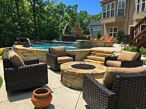 st. louis pool construction, brown wicker outdoor furniture with tan cushions, fire pit