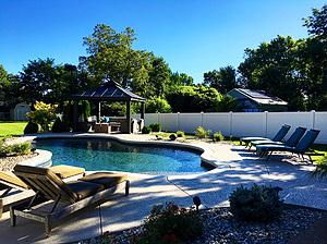st. louis custom designed freeform concrete pool with cantilever coping and black gazebo structure