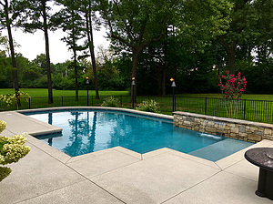 st.louis custom designed concrete pool with cantilever coping and raised wall with sheer descent