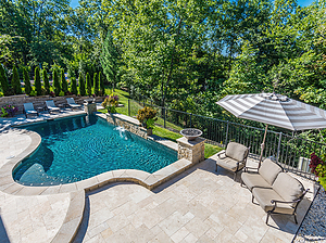 st. louis custom designed concrete pool, travertine patio, raised wall with sheer descent, fire bowls, seating area