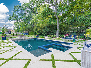st. louis custom designed geometric concrete pool, concrete spa with tile spillover, segmented patio, raised wall with sheer descent, water crystal jets, manicured topiary