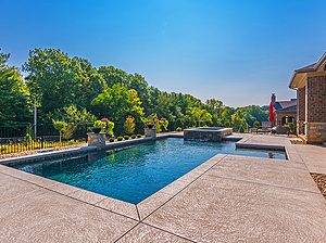 geometric st. louis custom designed concrete pool with fire bowls and spa