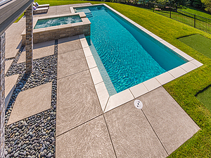 geometric st. louis custom designed concrete pool with spa and putting green