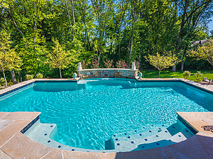 st. louis custom designed concrete pool with sheer descent and flagstone patio