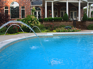 St. Louis custom designed Grecian concrete pool with federal stone coping and water crystal jets