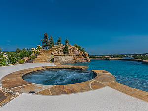 st. louis custom designed concrete pool, round spa with flagstone cap