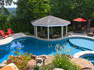 st. louis custom designed freeform concrete pool, gazebo structure with seating area, red patio chairs