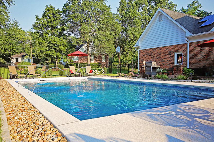 Town and Country Pool with Water Fall and Rock Landscaping