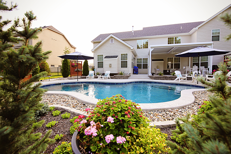 Chesterfield Pool with Tanning Ledge and Colorful Landscaping