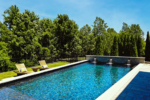 Pool With Copper Scuppers and Paver Patio