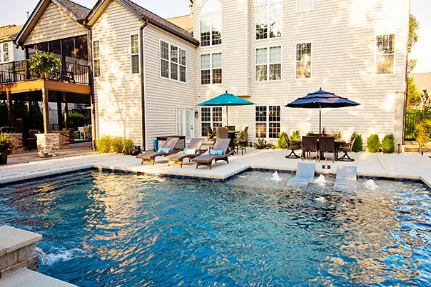 Pool With Copper Scuppers and Paver Patio