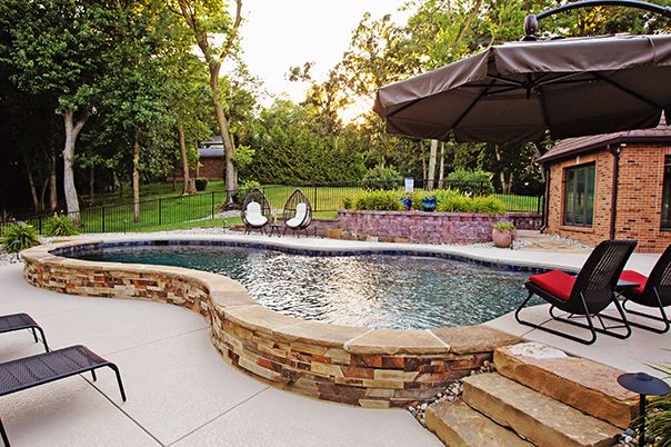 Pool With Exposed Masonry Wall