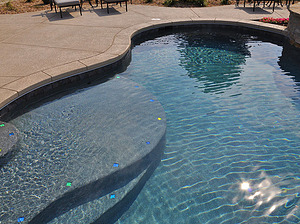 st louis pool construction, custom concrete pool, stair entry, tan shelf, accent tiles