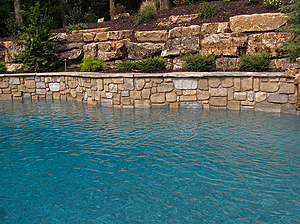 st louis pool construction, custom concrete pool, raised wall, pebble finish
