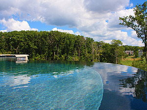 st louis pool construction, custom concrete pool, pebble finish, vanishing edge