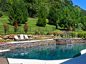 st louis pool construction, custom concrete pool, raised wall, pebble finish