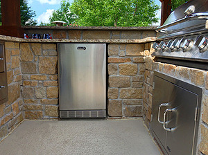 st. louis pool construction, outdoor kitchen with granite counter top and stone veneer, fridge, grill