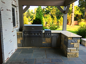 st. louis pool construction, covered outdoor kitchen with stone veneer, grill, blue flagstone patio