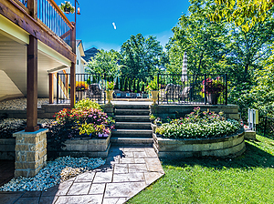 Steps leading from travertine patio up to pool area