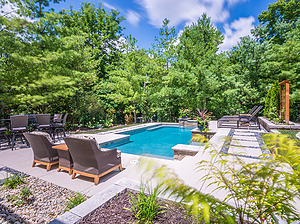 st. louis custom designed geometric concrete pool, stepping stone pathway, multiple seating areas