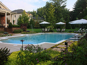 st. louis custom designed grecian concrete pool with federal stone coping, water crystal jets and large tan shelf with lounge chairs