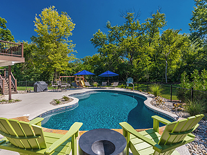 st. louis custom designed freeform concrete pool, cantilever coping, green patio furniture