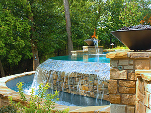 st. louis custom designed concrete pool, tiled vanishing edge, fire bowls, water bowls