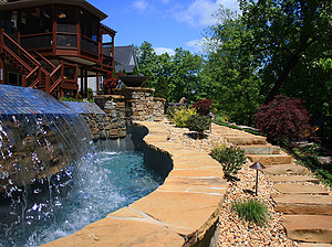 st. louis custom designed concrete pool, tiled vanishing edge, ledge rock steps