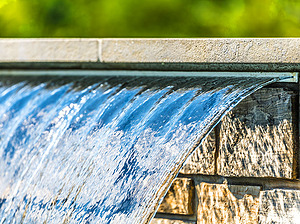 St. Louis custom designed concrete pool with sheer descent water feature