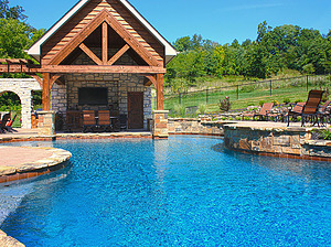 st. louis custom designed freeform concrete pool, wood and stone structure with pergola and seating area