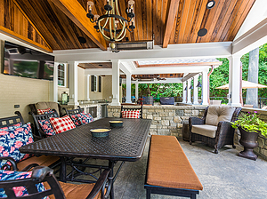covered patios with wood ceilings, seating area with table, bench and chairs